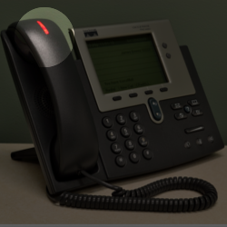 Desk Phone with the voicemail notification button highlighted.