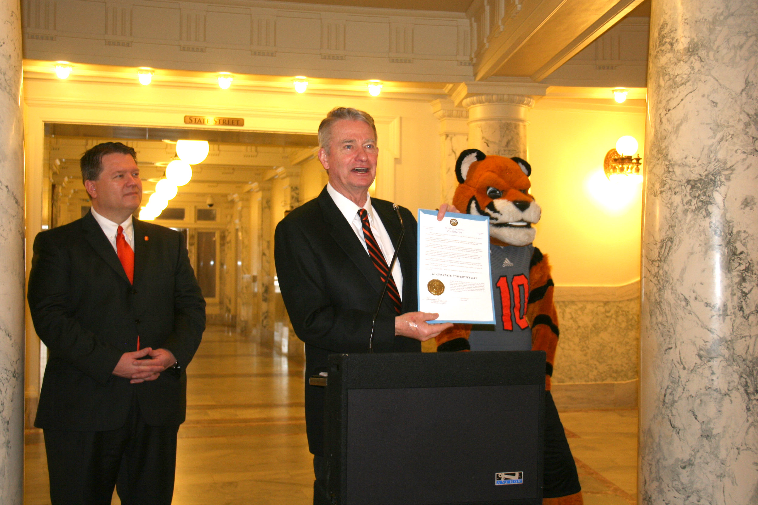 ISU President Kevin Satterlee, Idaho Gov. Brad Little and Benny the Bengal with the proclamation