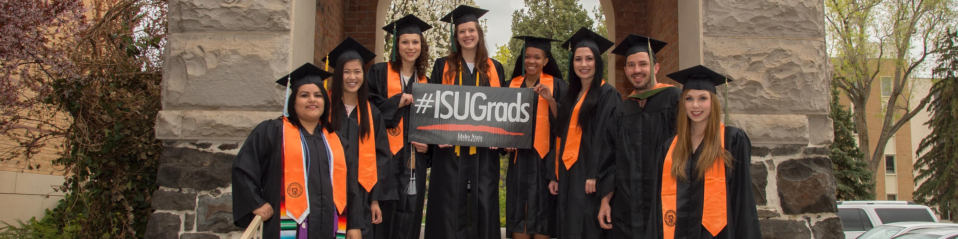 ISU graduates in front of Swanson Arch