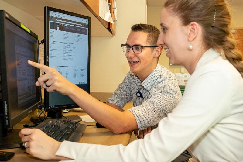 Two students at a computer screen