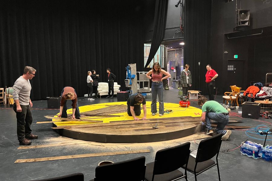 Students and faculty building the set at the Spokane theater