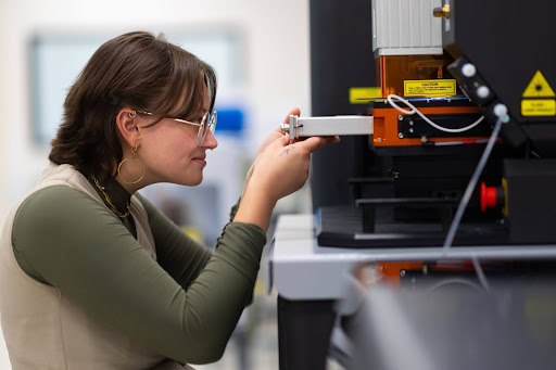 Cheyenne Eartelt, a master's student in geology, loads Zircon samples into ISU's mass spectrometer and laser ablation system