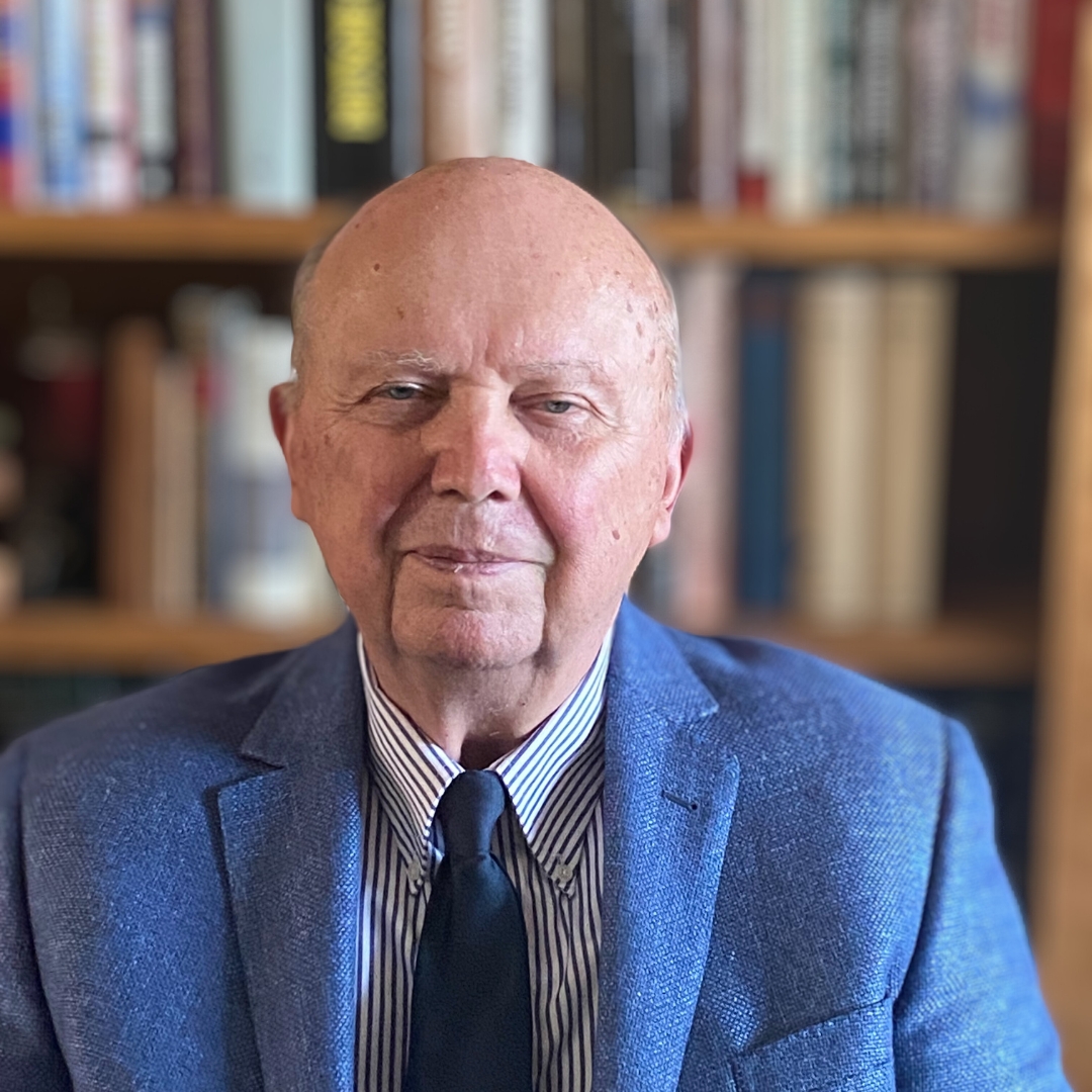 headshot of Nickisch with bookshelves in the background
