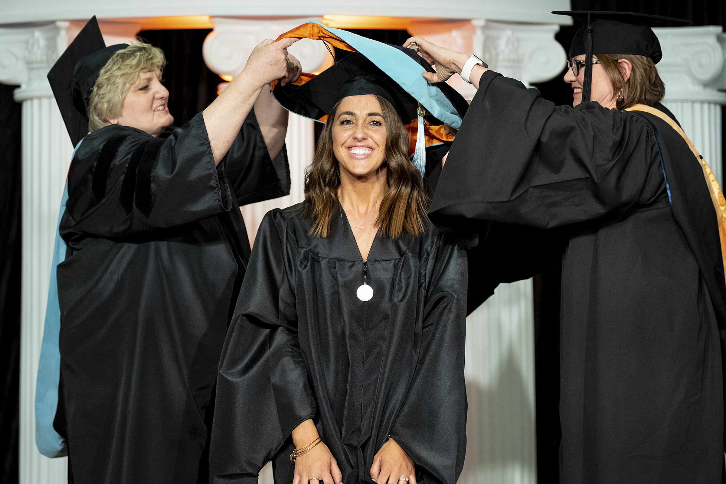 woman being hooded at hooding ceremony