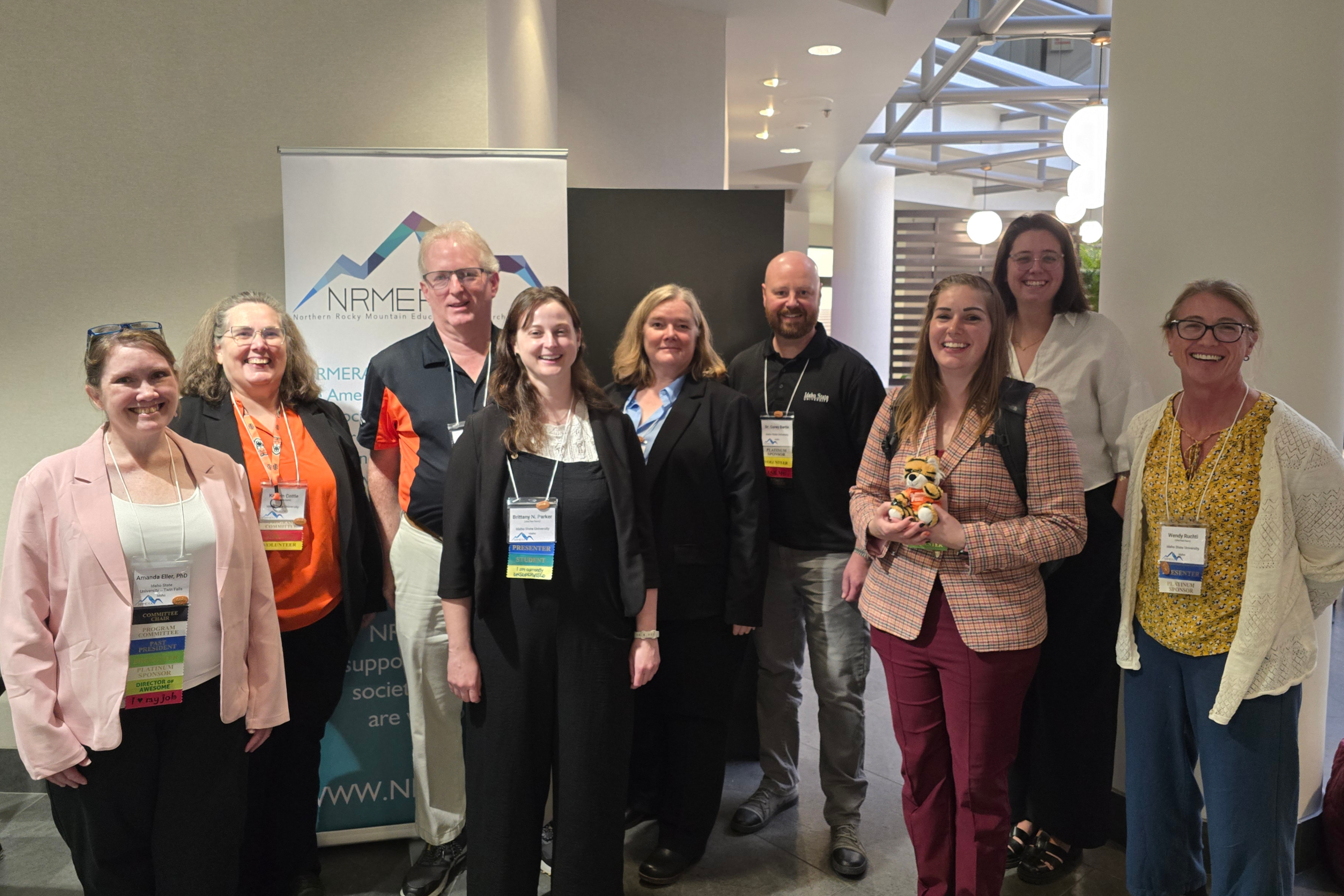 College of Education faculty and students posing at NRMERA Conference