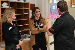 Idaho State University College of Education Dean and professors meet with teachers at a local middle school during a celebration event.