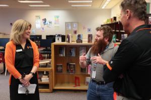 Idaho State University College of Education Dean Jean McGivney-Burelle with local Pocatello/Chubbuck School District Superintendent Dr. Howell meeting with high school teachers during a celebrating event. 