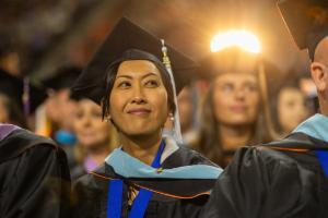 Idaho State University doctorate student attends the winter commencement ceremony and earns a graduate degree.