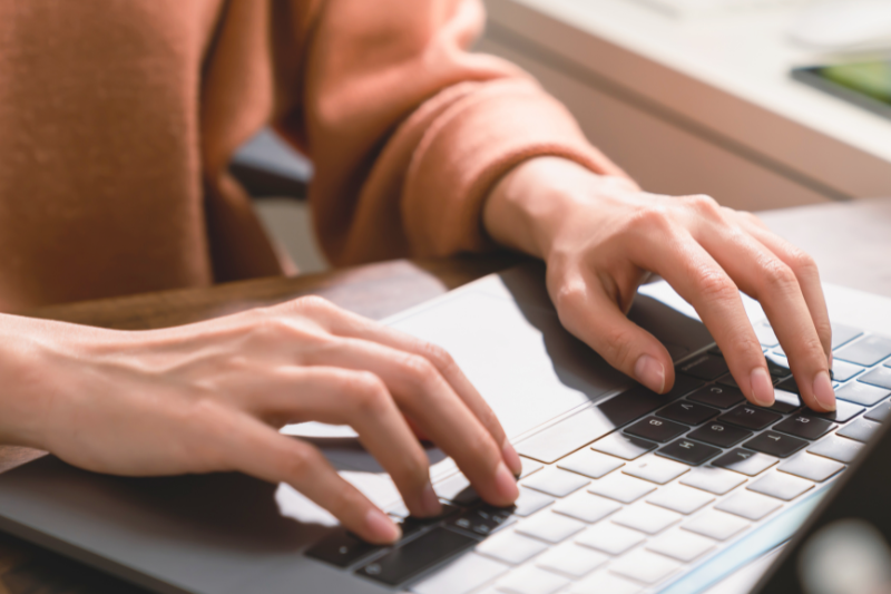 Hands on a computer's keyboard