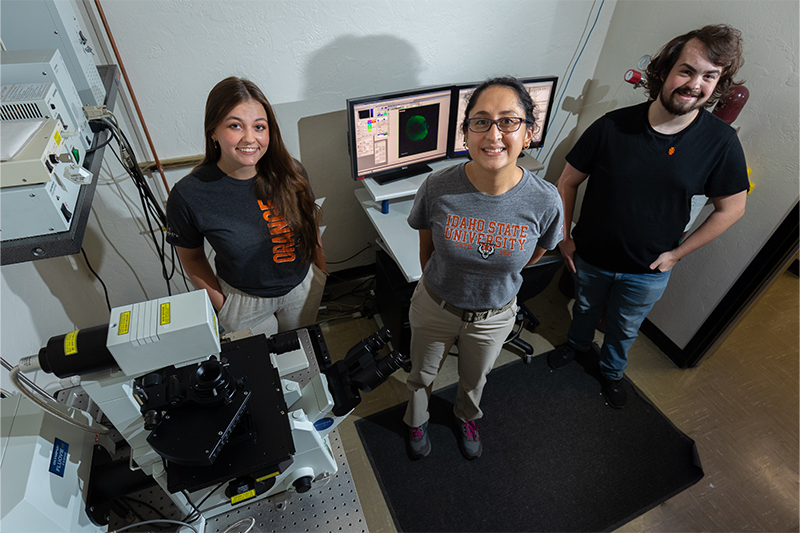 Brooke Wheeler, Lizbeth de la Cruz, and Danny Whisman pose for a photo in the Advanced Imaging Core Facility.