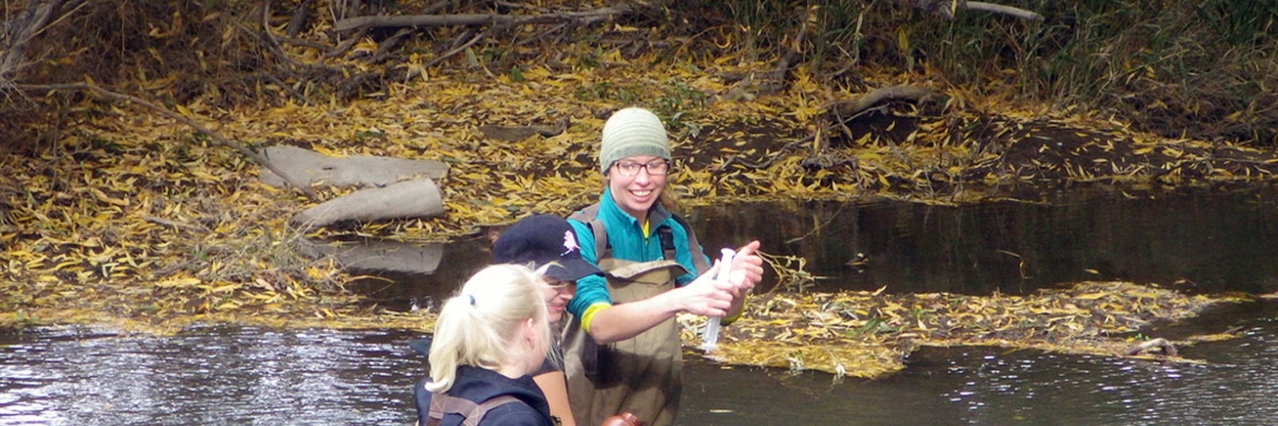 Students in river testing the water
