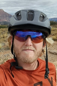 David Johnson wearing a bike helmet and visors