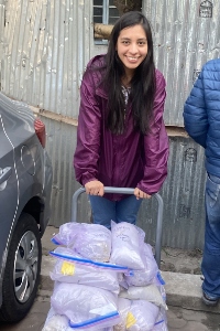 Maria Reinoso with a cart of sediment mixture samples