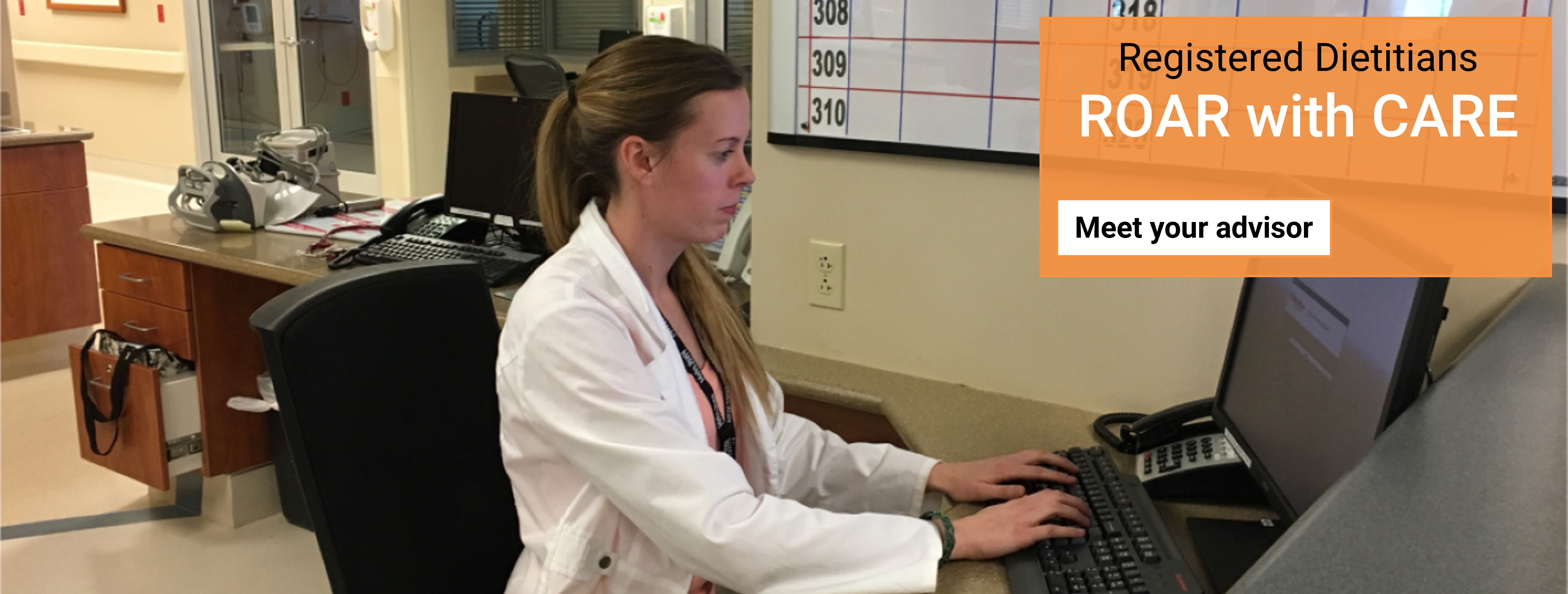 Dietetic intern in hospital charting in electronic health record