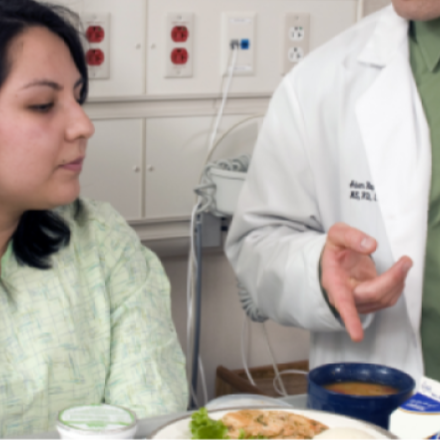 dietitian with patient in hospital
