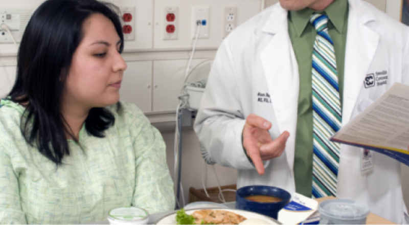 dietitian with patient in hospital