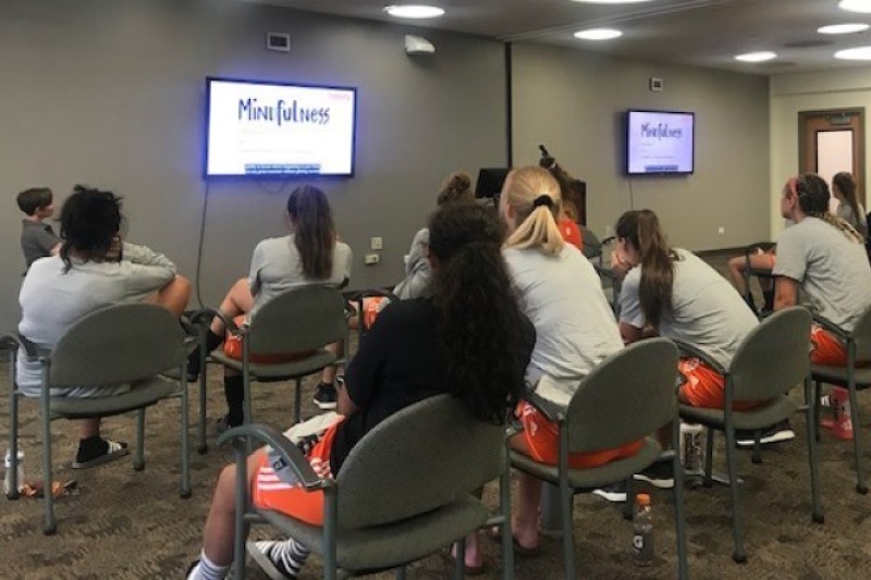 Women's soccer team  at mindfulness seminar