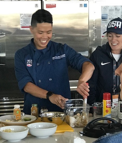 Asian male dietitian gives cooking demo at the Olympic Oval: Speed Factory