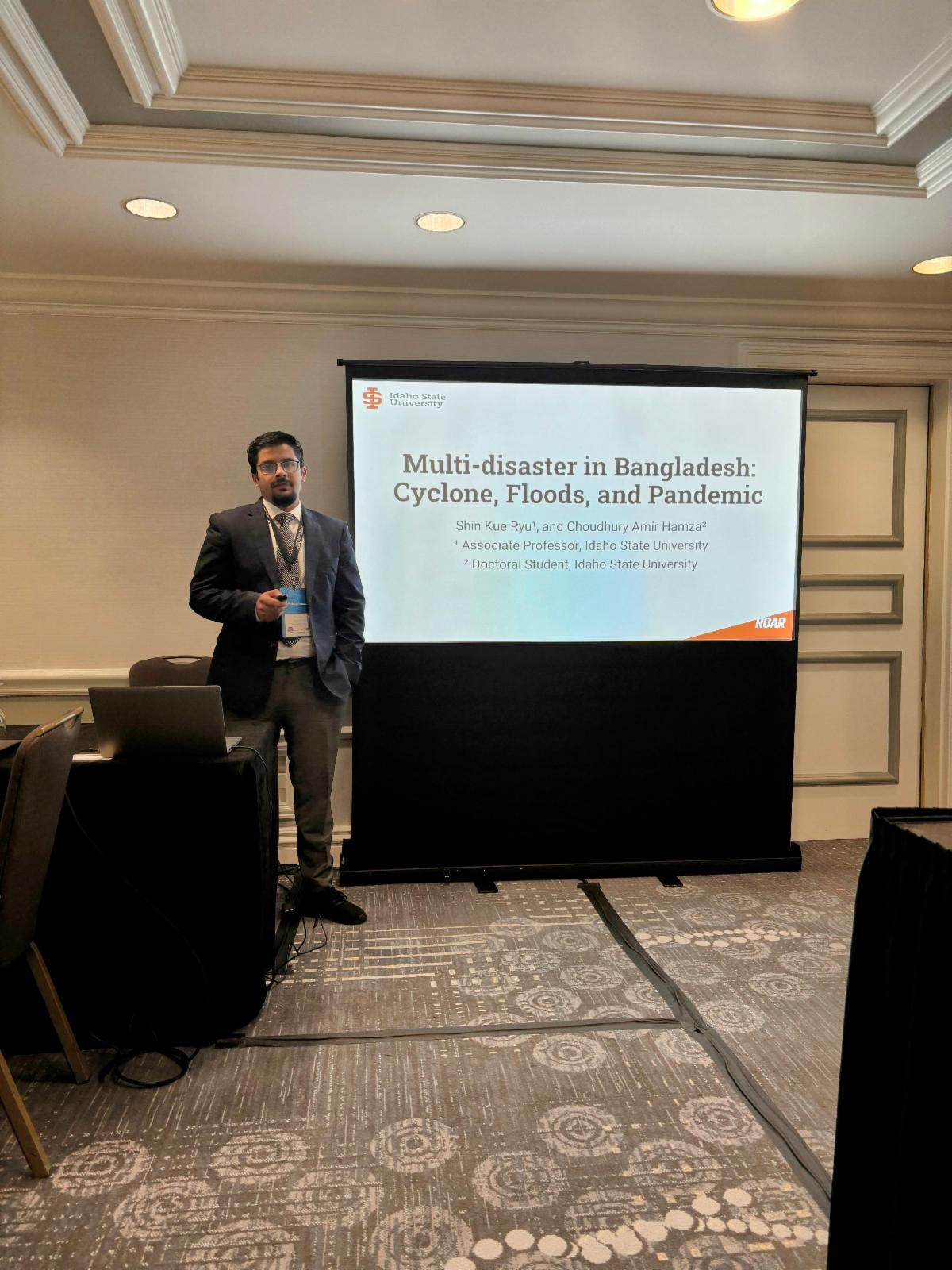 Choudhury Amir Hamza presenting his poster,