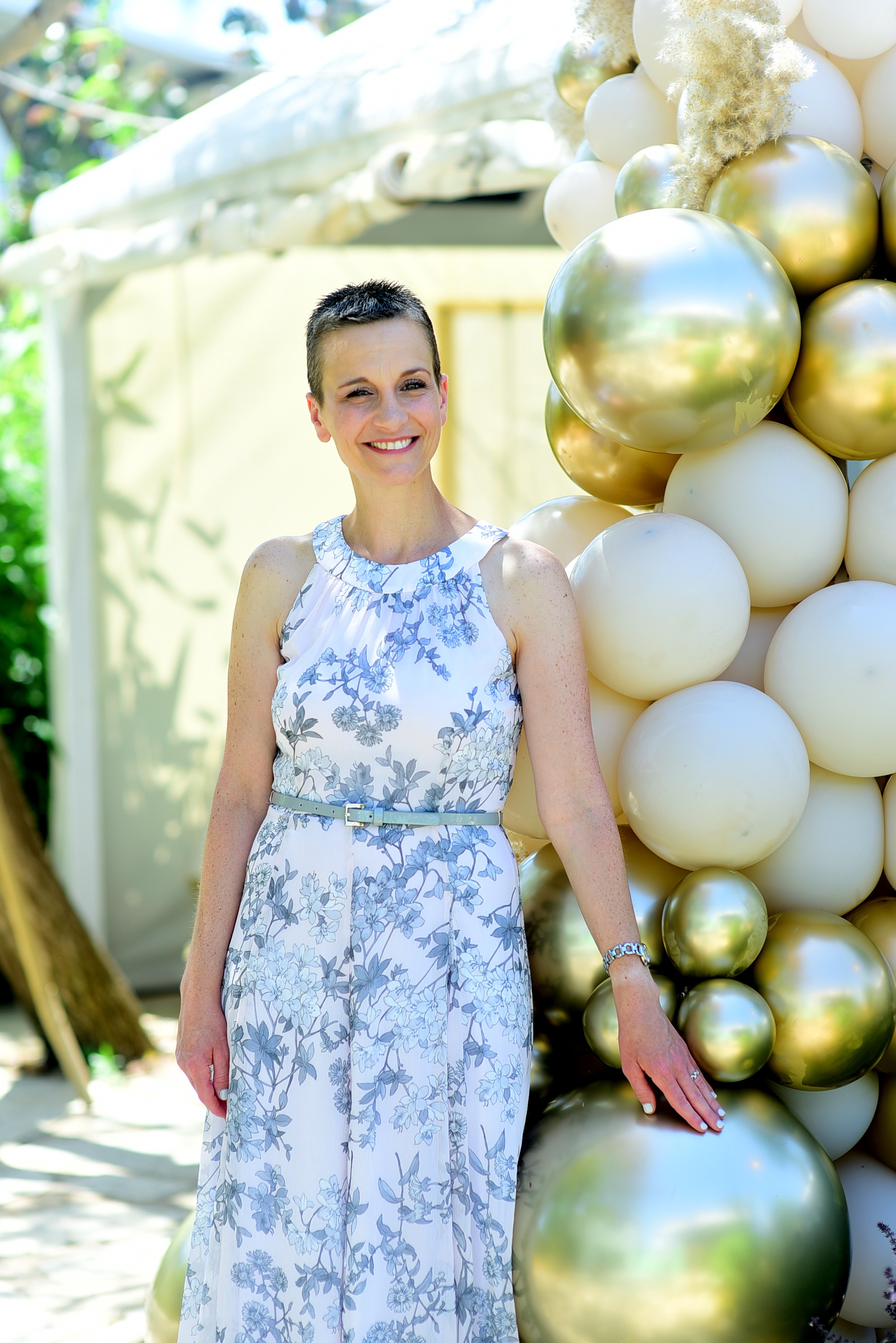 Tali Rotman posing in front of balloons