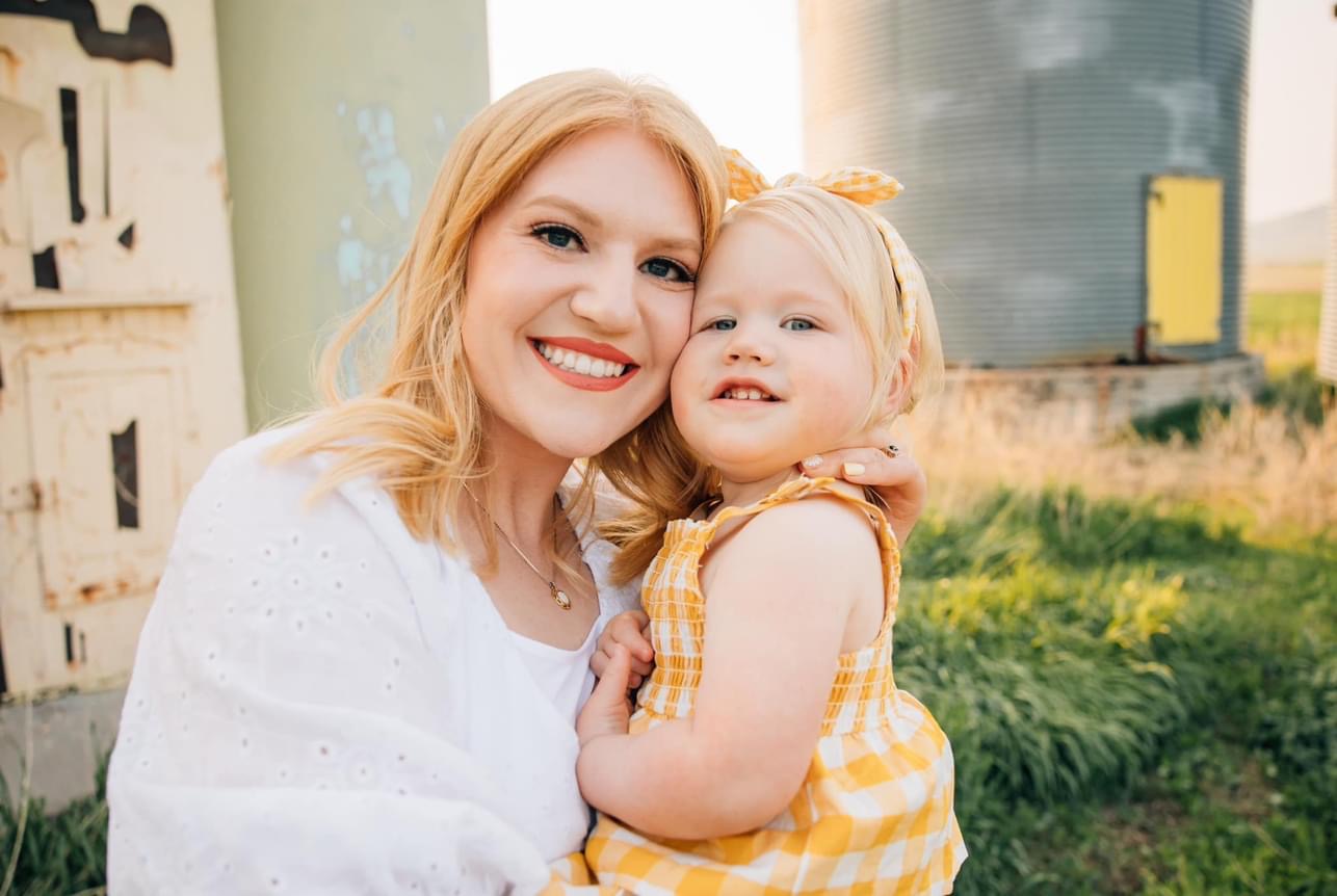 A Photo of Makenna Workman holding a small female child