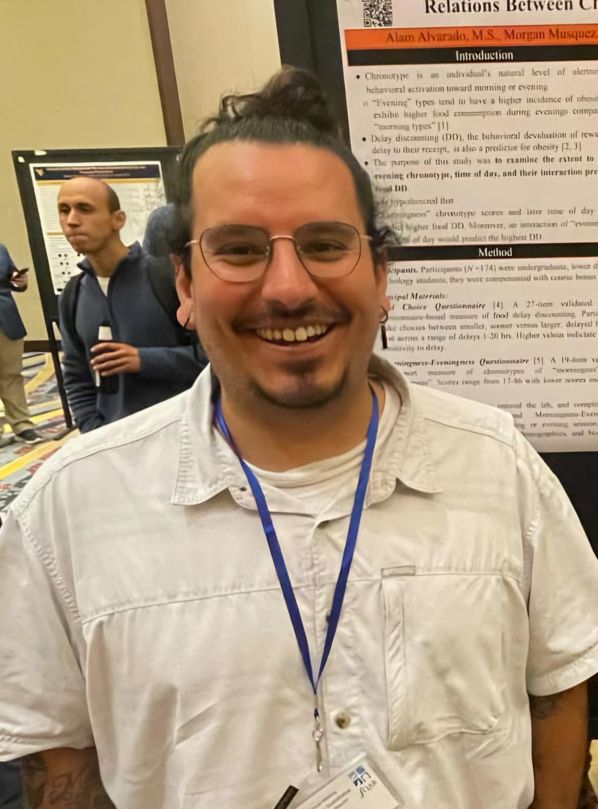 Alam Alvarado posing with his conference poster
