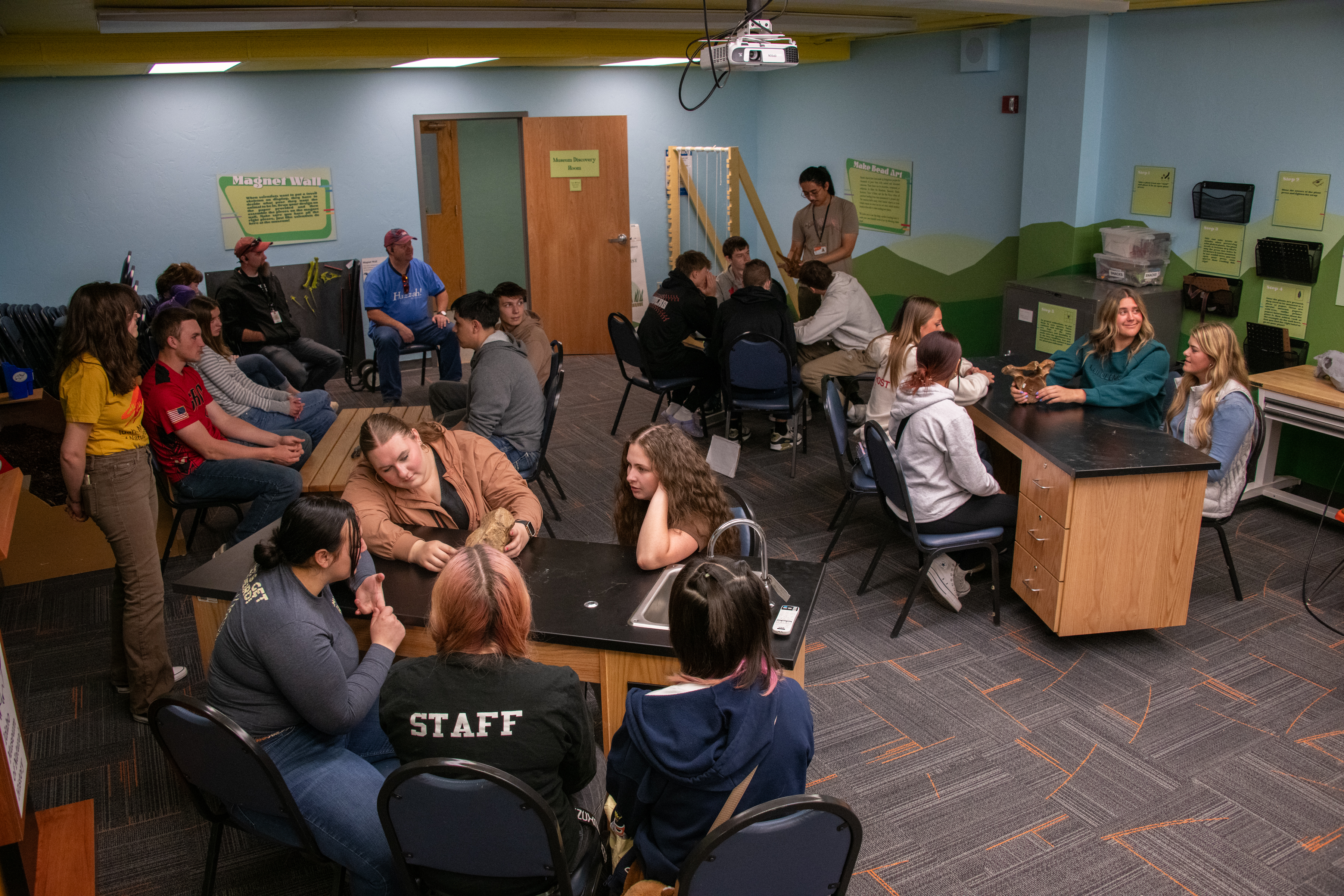 Group of learners engaging with fossils in a self guided discovery