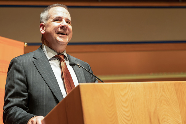 President Wagner standing behind a podium