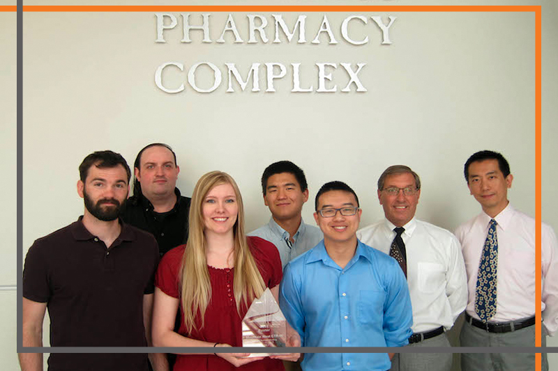 A team of ISU-Meridian researchers poses outside the Skaggs Pharmacy Complex in Meridian. Danny Xu (right), and Vaughn Culbertson (second from right) lead the team