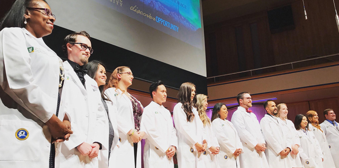 Students receive their white coat at a ceremony in Anchorage, AK
