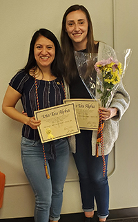 two students receiving award