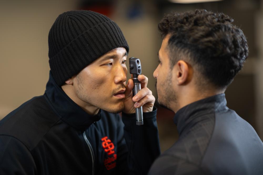 Image of a student doing an eye exam.