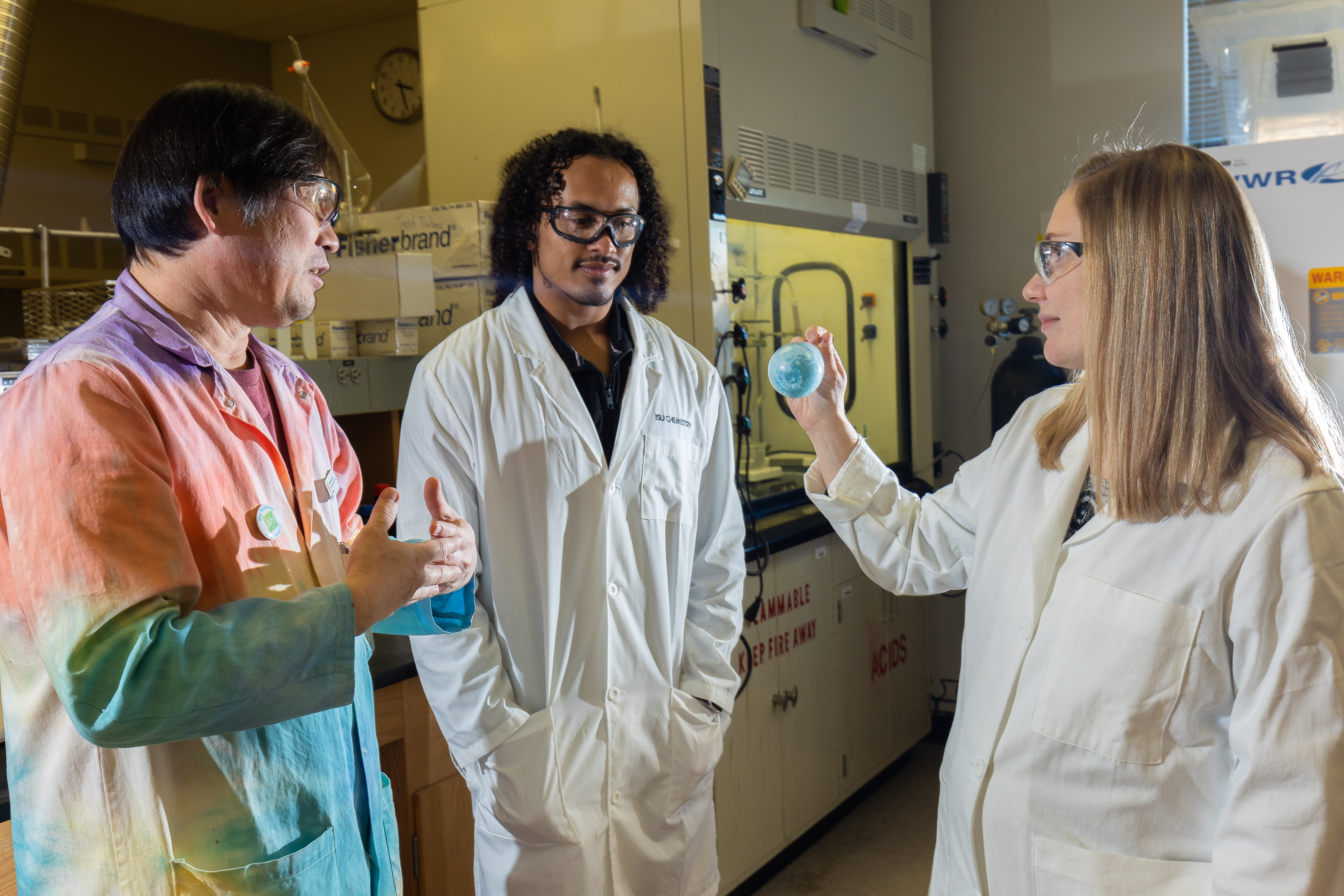 Joshua Pak, professor and chair of the chemistry department, Raiden Hunter, and Cori Jenkins, assistant professor of chemistry, pose for a photo