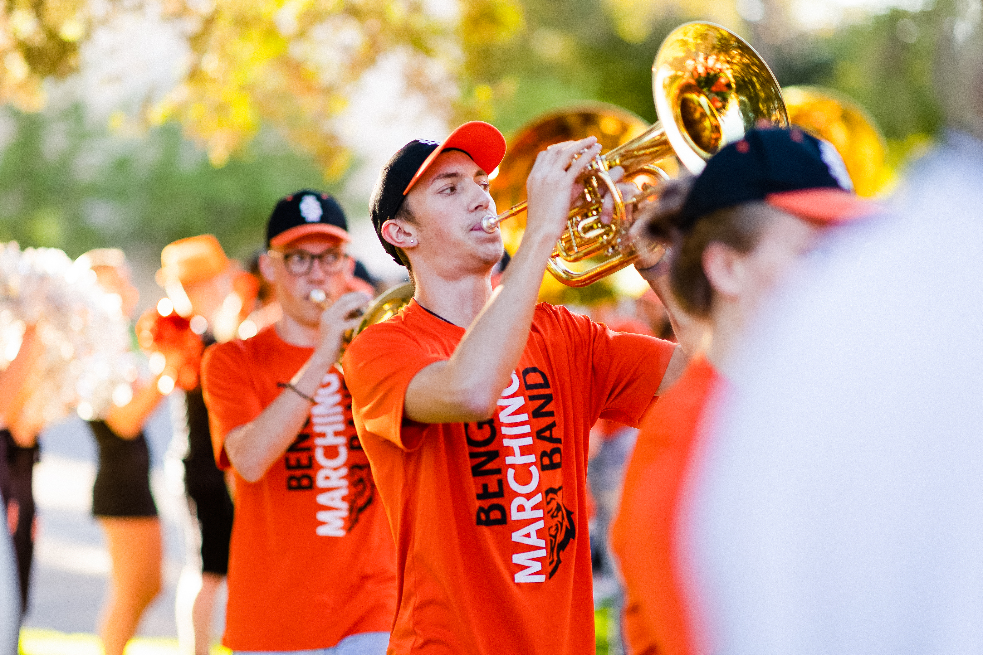 Student musicians playing brass instruments at an ISU event