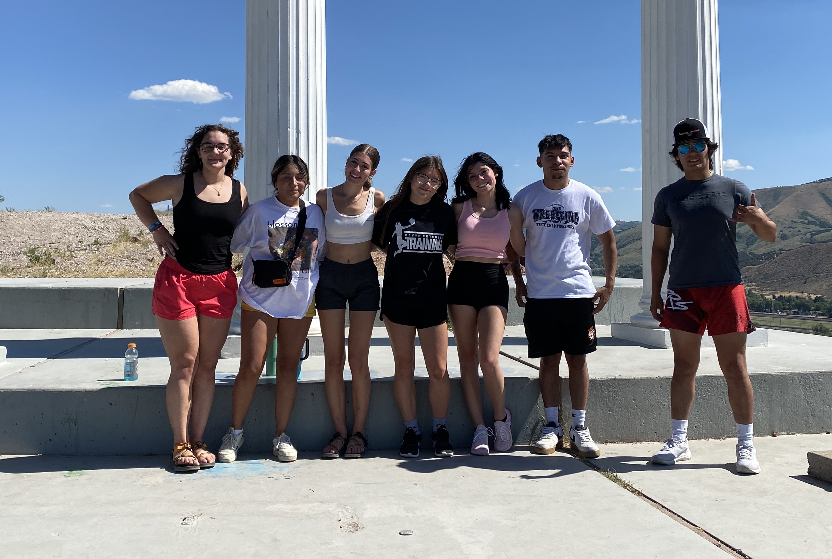 Group photo taken at the pillars on Red Hill