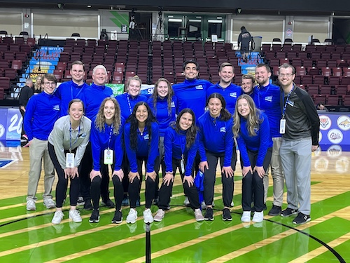 A group of students pose at the Big Sky Tournament