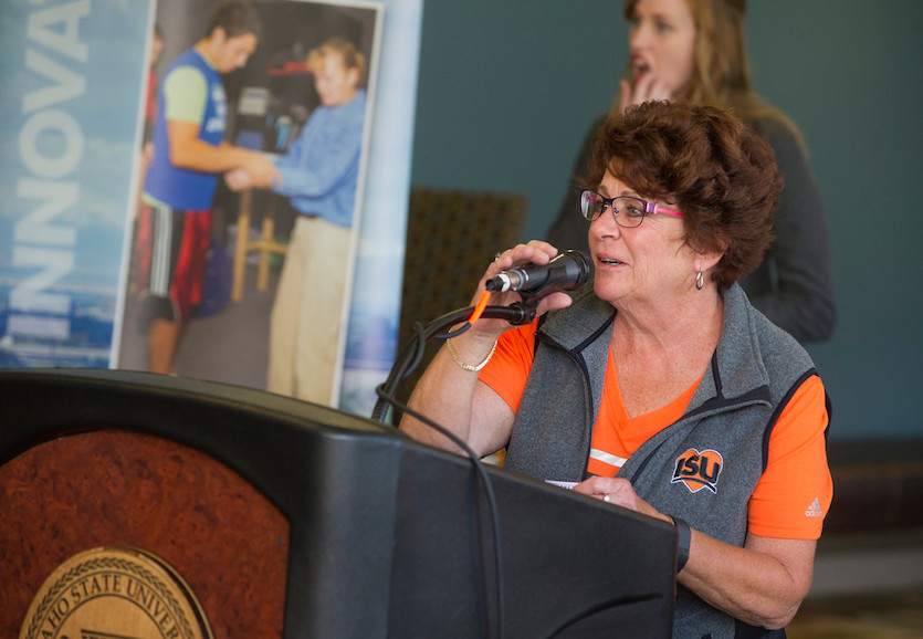 Mary Vagner speaking at a podium at an I Love ISU event.