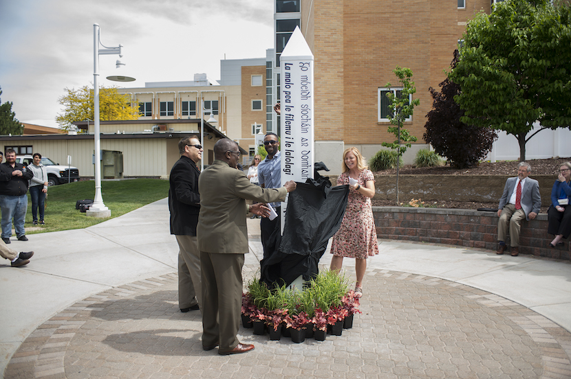 Dignitaries are shown unveiling the Peace Pole that is by the Rendezvous Complex.