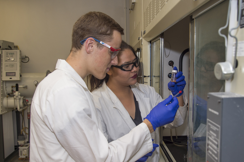 Photo of SEED students Sean Morrissey and Edith Gonzalez at work in a chemistry lab.