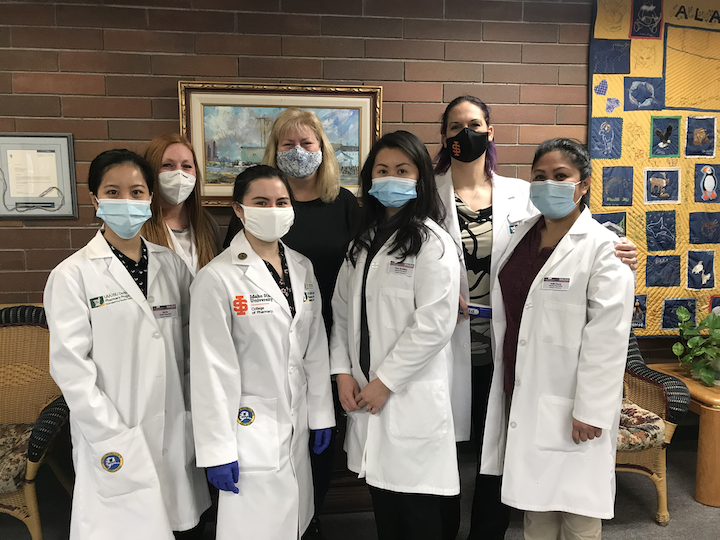 Group photo of Anchorage students who are administering COVID vaccines