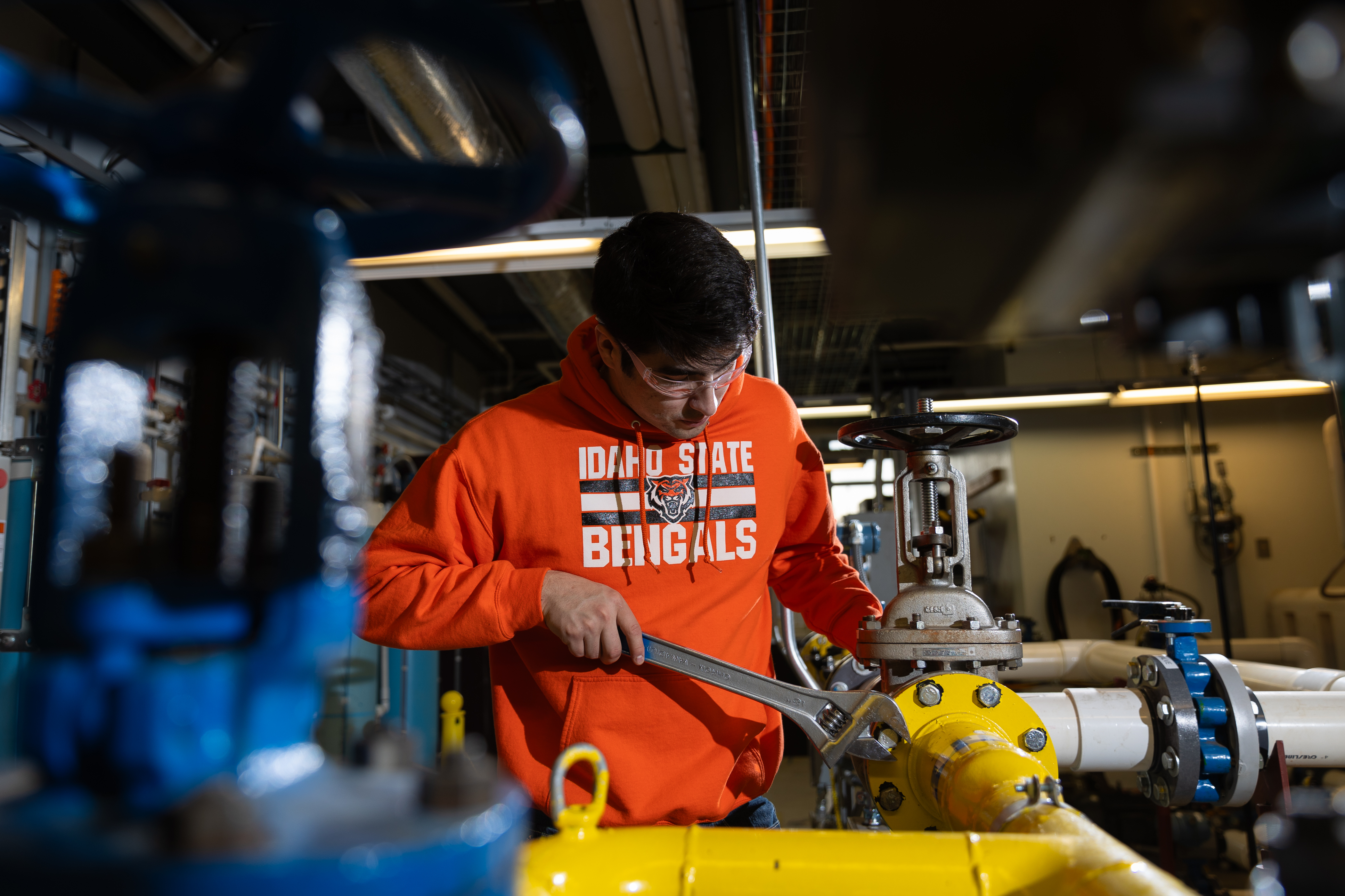 A student works with mechanical engineering equipment in the College of Technology