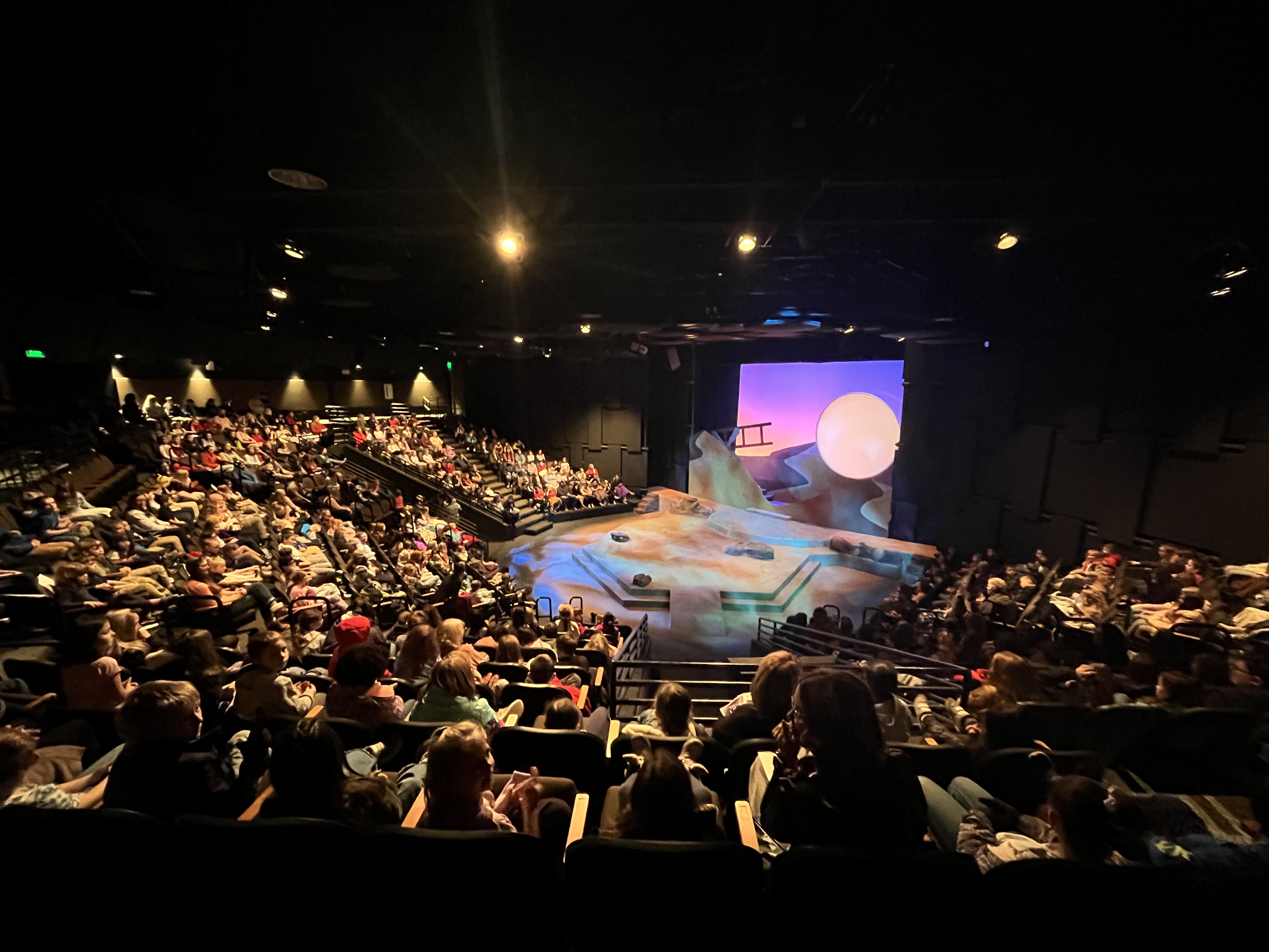 Elementary students from Pocatello eagerly anticipate the opening scene of The Little Prince