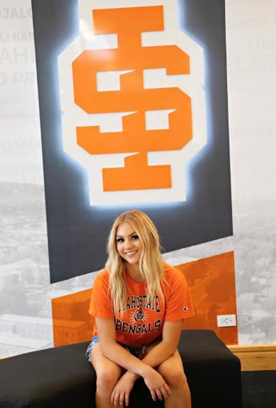 Miss Idaho Madi Andreason in front of the ISU welcome sign in the SUB