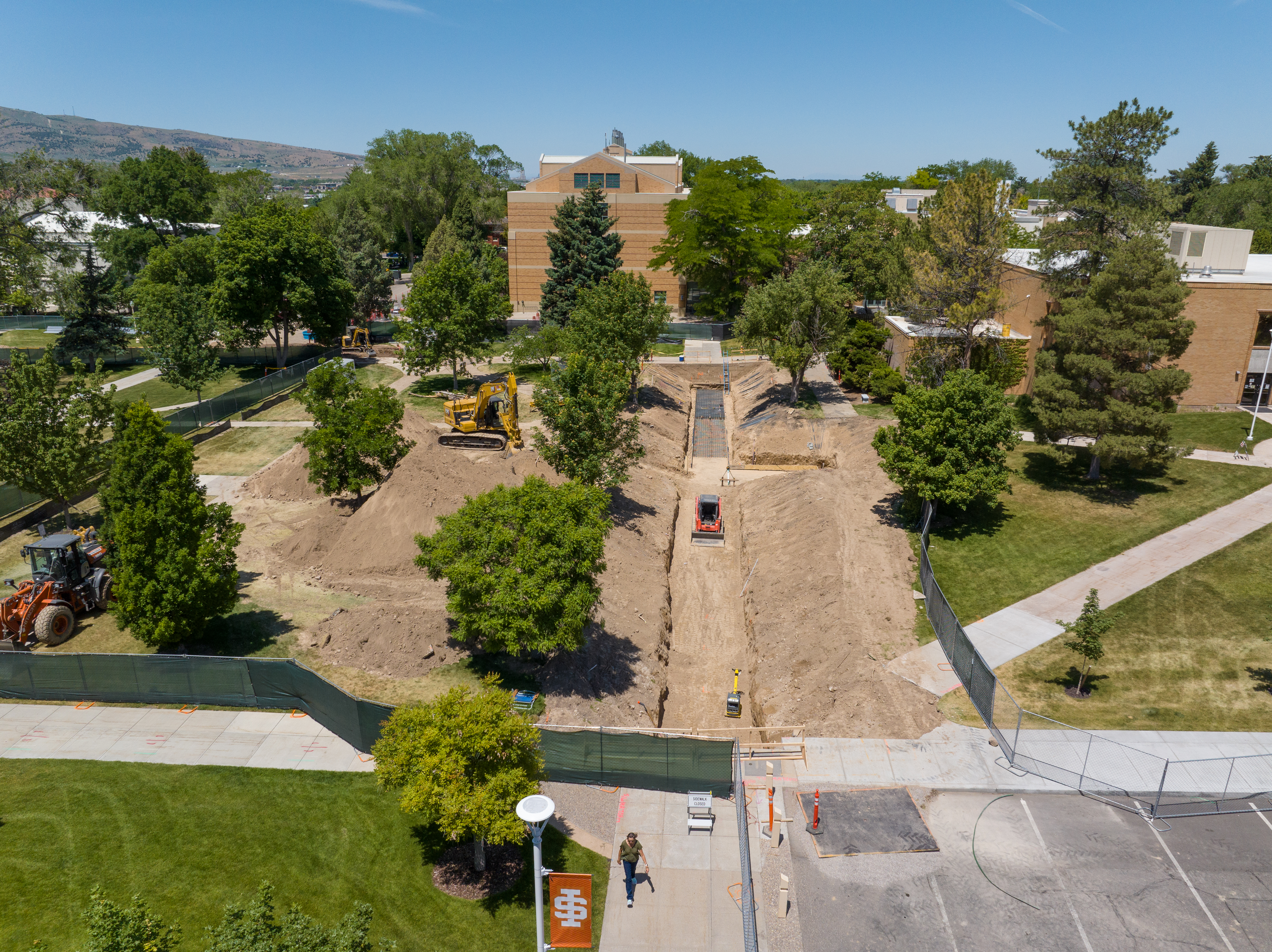 Aerial view of work being done on a water main on the ISU quad