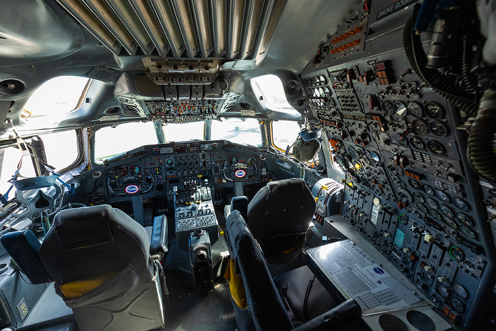 Inside the cockpit of NASA's retired DC-8 airplane showing hundreds of buttons and switches