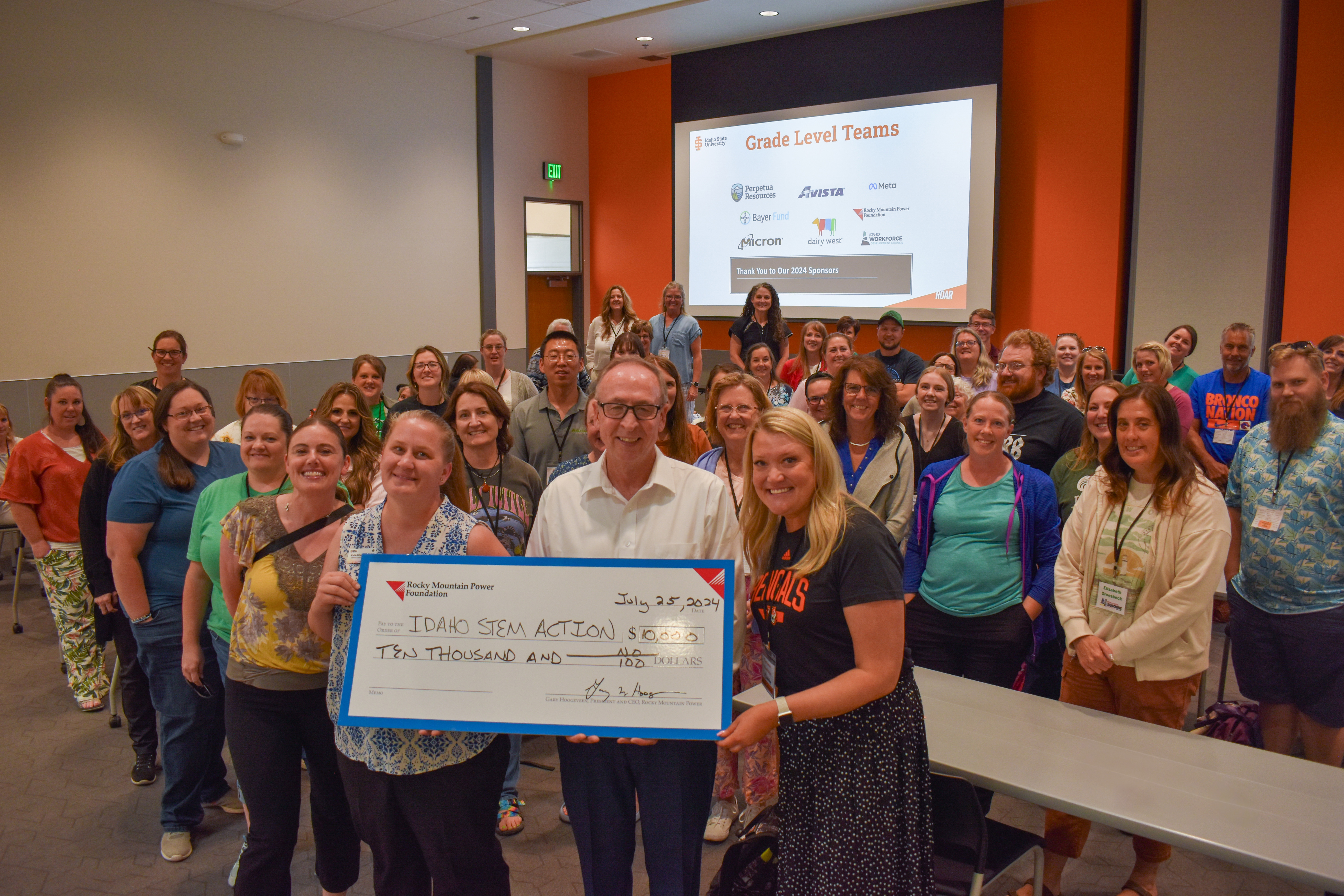 Members of the Idaho Stem Action Group receives a $10,000 check from Rocky Mountain Power Foundation