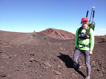 A photo of Erin Sandmeyer in the field at Craters of the Moon.