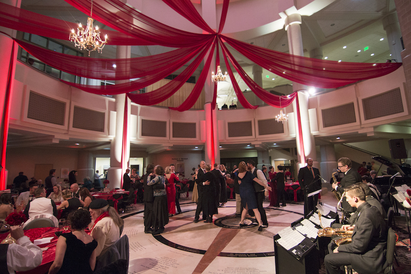 Photo of people in formal gear dancing at Stephens Performing Arts Center during a previous New Year's Eve Gala
