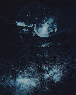 Photo of a painting the looks like outer space.