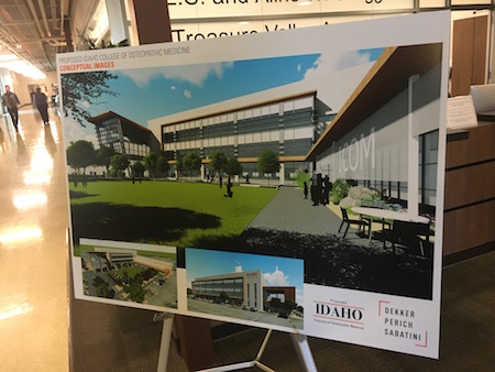 A photo of a poster of a rendering of the new ICOM Building.